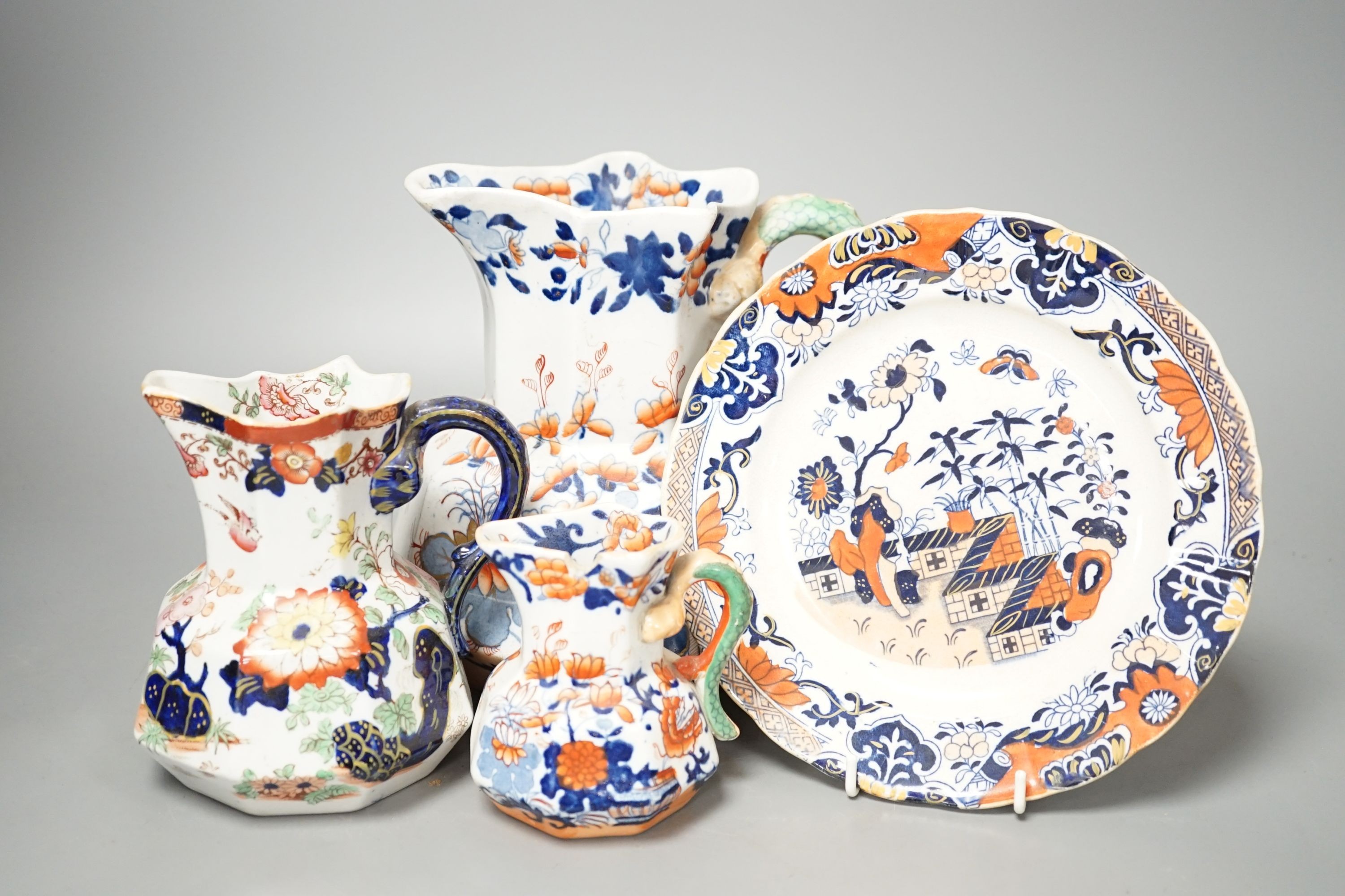 Four graduated Mason’s hydra jugs, tallest 19cm., and eight various ironstone or earthenware plates